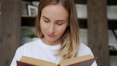 Woman Reading a Book Indoors