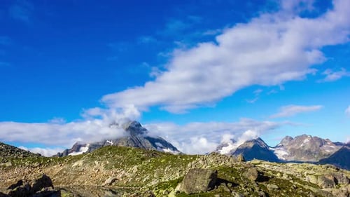 Majestic Mountains under Blue Sky and Clouds