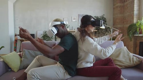 Couple Exploring Virtual Reality World Together Indoors