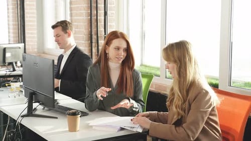 Female Office Workers Working Together with Smile on Face