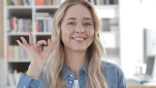 Blonde Woman Giving OK Sign Close Up