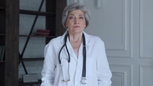 Senior Woman Doctor in Lab Coat and Stethoscope
