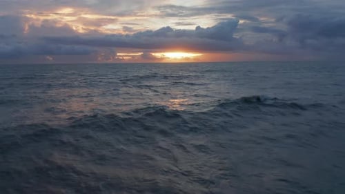 Small Waves on Ocean Surface During Warm Evening Light