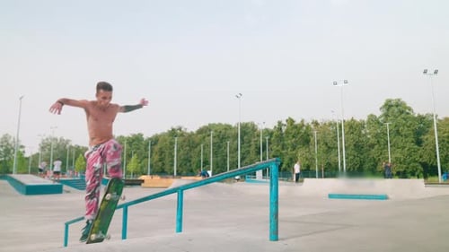 Skateboarder Performing a Trick on an Urban Rail