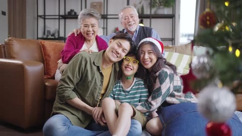 Happy Family Celebrating Christmas Together at Home