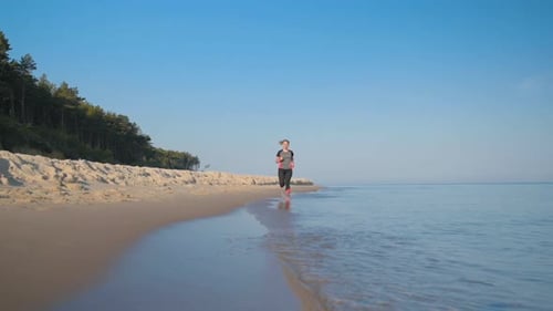 Woman Runs on Sea Beach