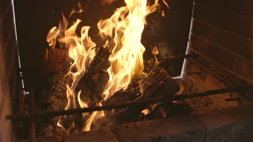 A Brightly Blazing Bonfire Burns the Blackened Firewood and the Walls of the Barbecue