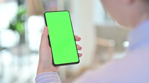Rear View of Female Using Smartphone with Chroma Screen