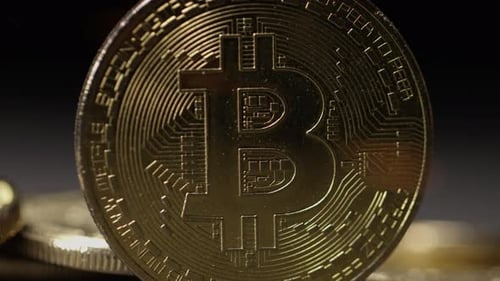 Cryptocurrency on the block chain - close up of bitcoin altcoin physical coins in dynamic setting