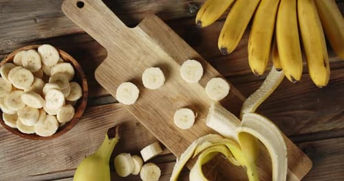 Fresh Banana Slices on a Wooden Surface