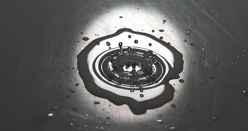 Drop of Water falling into Water, Slow motion 4K