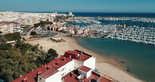 Aerial View of Beach and Yachts Port in Tourist City Drone Approaches to the Sea
