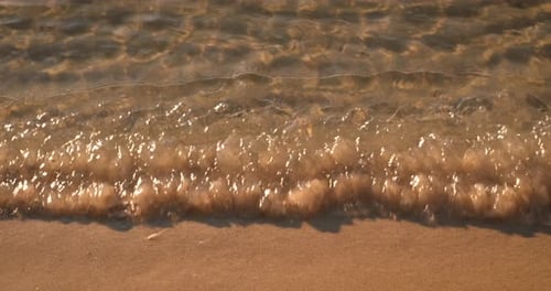 Golden Hour Waves Lap Sandy Beach With Travel Message