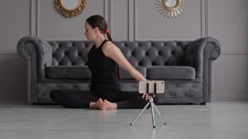 Woman Stretching Arms During Indoor Yoga Workout