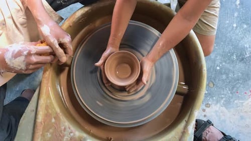 A Little Boy in a Pottery Class