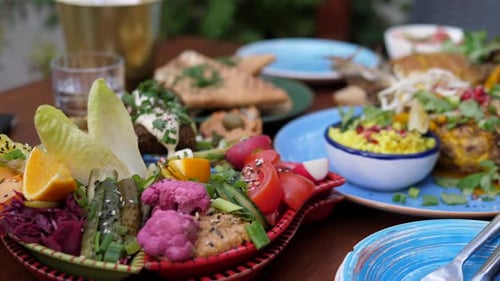Vegan Garden Party Food. Middle Eastern Meze of Hummus, Falafel Baba Ganoush, Tabbouleh and Pickles