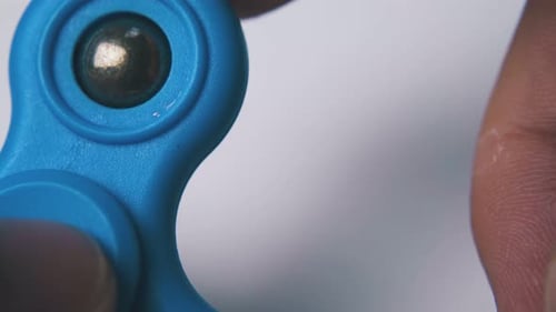 Blue Fidget Spinner Spinning Fast Close Up