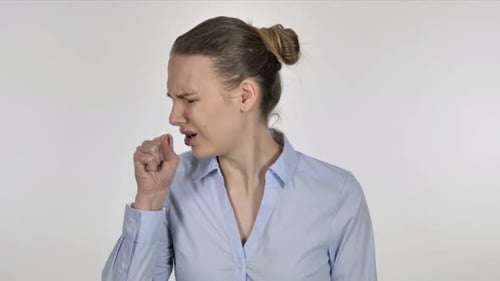 Young Woman Coughing and Holding Her Chest