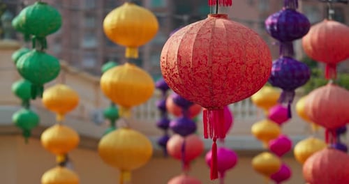 Colorful Asian Lanterns Hanging in Urban Scene