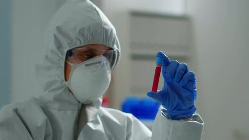 Scientist Examining Test Tube in a Laboratory Setting