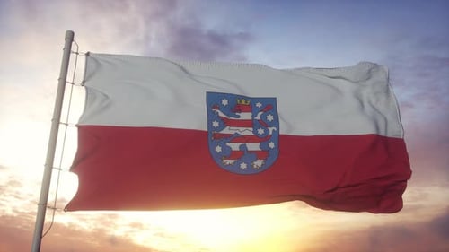 Flag of Thuringia Waving Realistically Against Sunset Sky