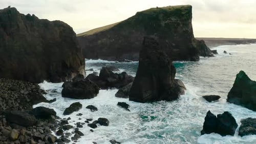 Scenery Of Rocky Cliffs With Breaking Waves In Reykjanes Peninsula, Iceland. Aerial Orbiting