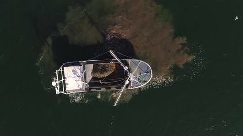 Boat Anchored in the Middle of the Water