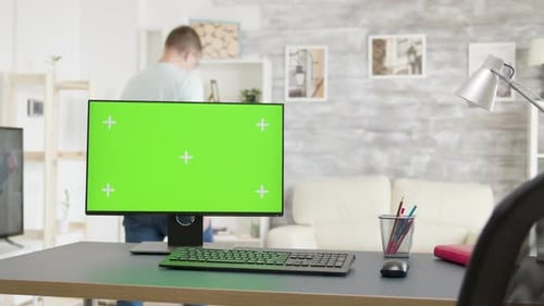 Cozy Bright Living Room with an Isolated Green Screen Monitor on the Table