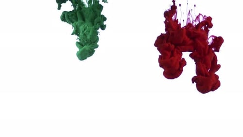 Green and Red Ink Swirling in Water