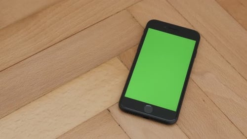 ZAJECAR, SERBIA - NOVEMBER 2016 Close-up of black phone with green screen chroma key display slow ti
