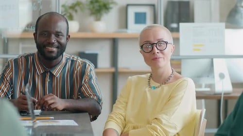 Portrait of Positive Afro Man and Caucasian Woman in Office