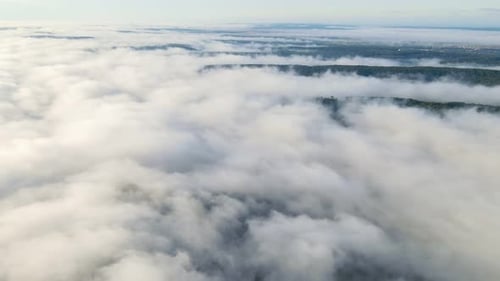 Aerial View of Clouds and Forest Landscape