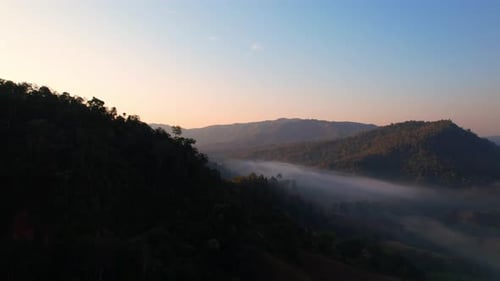 4K Aerial view of Mountains landscape with morning fog.