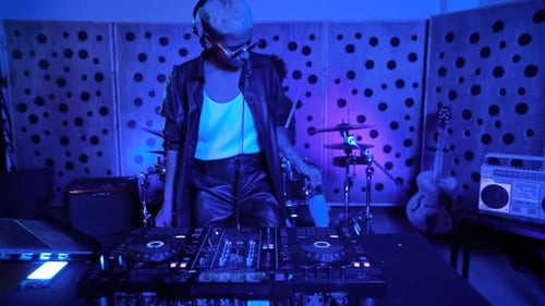 DJ playing music with mixer player in house studio - Youth musician entertainment concept