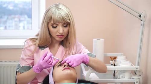 Aesthetician Performs Beauty Treatment on Patient's Face