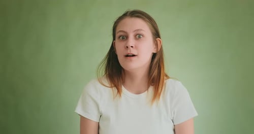 Shocked Young Woman Becomes Very Angry Posing for Camera