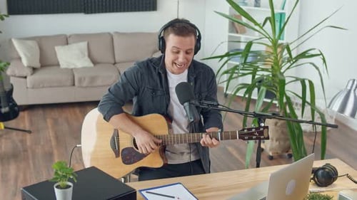 An Influential Musician With a Guitar Writes Music at Home Music Studio Spbd