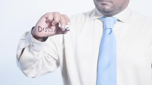 Man Writes Disclaimer with Marker