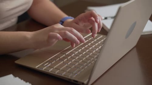 Close Up of Hands Typing on Laptop Keyboard