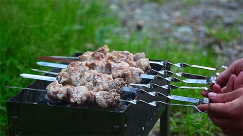 Meat Shish Kabobs Cooking on Charcoal Grill