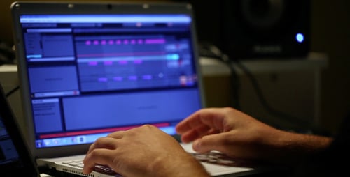 Typing on a Laptop in a Dark Room