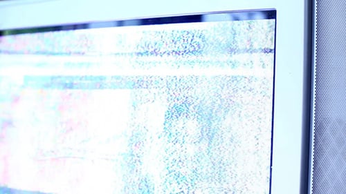 Television Displaying Bright White and Blue Static