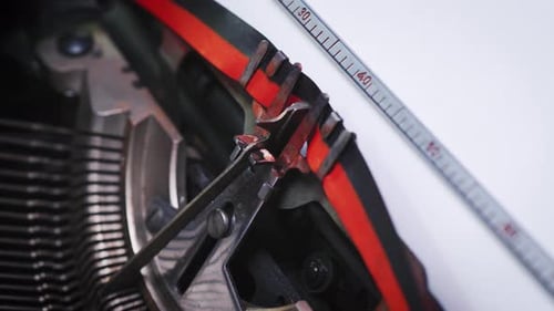 Antique Typewriter Types 'Love' in Red Ink