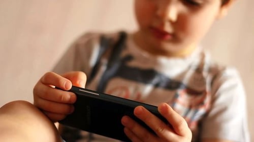 Child Using Smartphone at Home