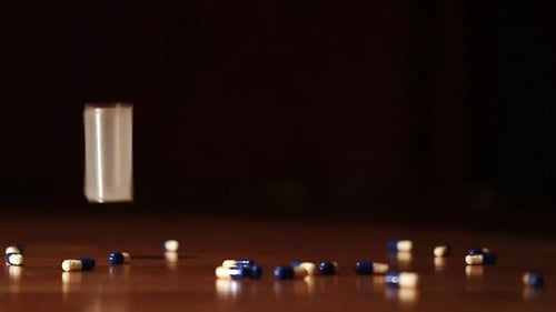 Tablets And Bottle Falling On The Floor