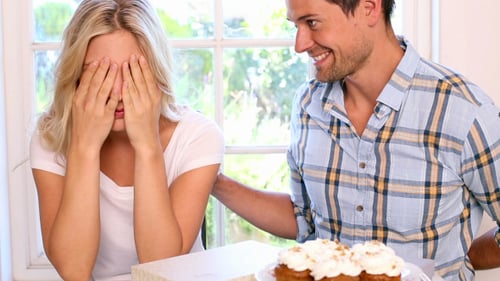 Loving Couple Celebrates Birthday with Gift and Embrace