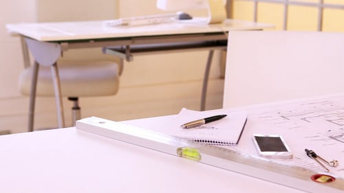Architects Desk With Stationery And Blueprint