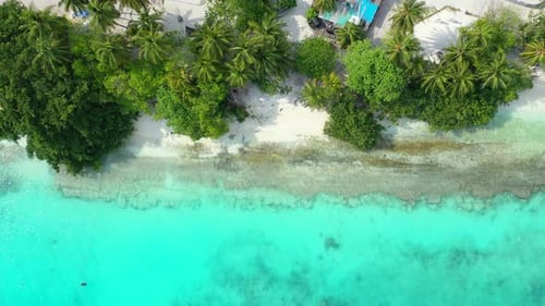 Beautiful fly over abstract shot of a sandy white paradise beach and aqua turquoise water background