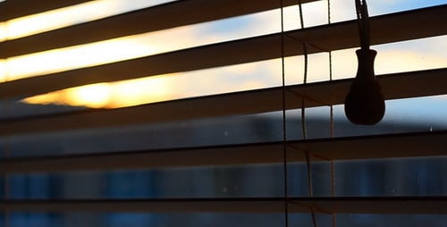 Wooden Blinds with Bright Sunrise Light Shining Through