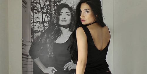 Elegant Woman Styles Long Black Hair Indoors